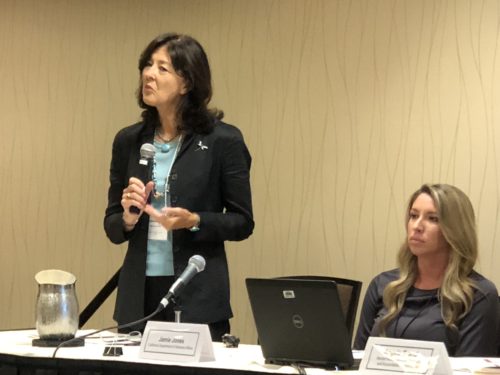 an image of two women at a speaking panel